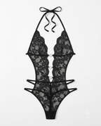 Black lace halter bodysuit with strappy details and a tie-neck bow, shown flat against a white background.