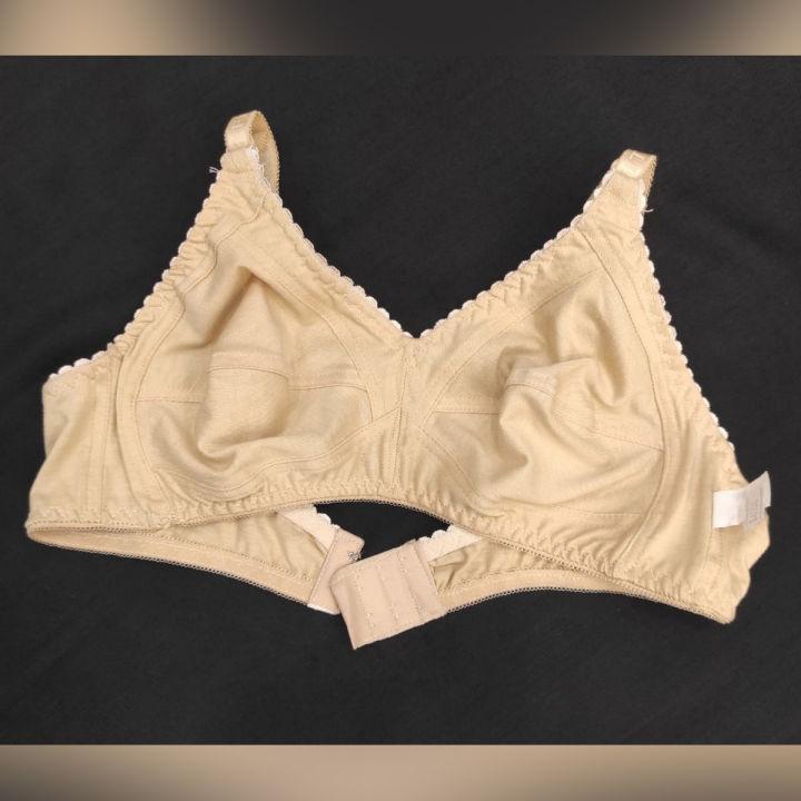 Beige bra on a black background