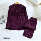 Purple satin pajama set on a white bed with 'PURPLE' text at the bottom.