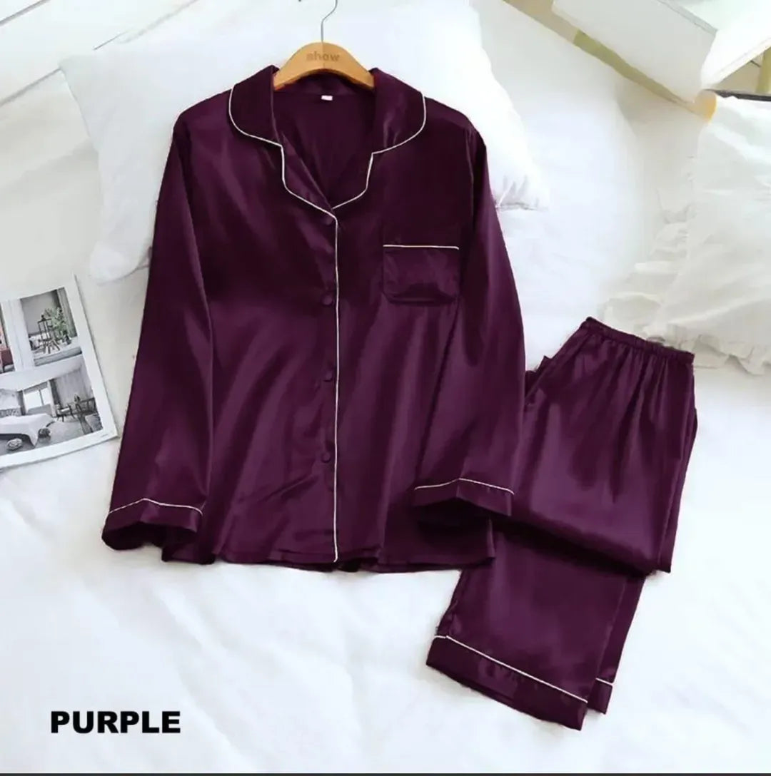 Purple satin pajama set on a white bed with 'PURPLE' text at the bottom.