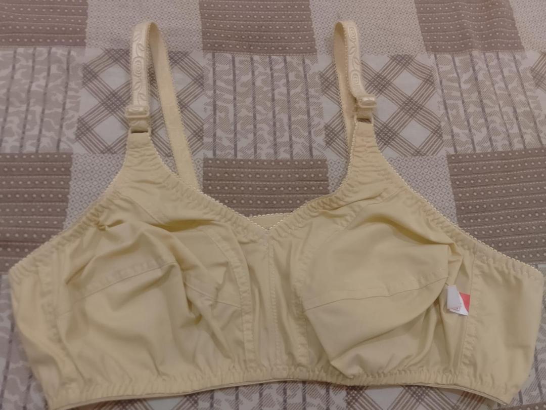 Beige bra on a patterned fabric background