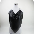A black sequined mesh halter top draped over a white mannequin torso, set against a plain white studio background.