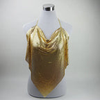 A gold sequined halter top draped over a white mannequin torso, photographed against a light gray studio background.